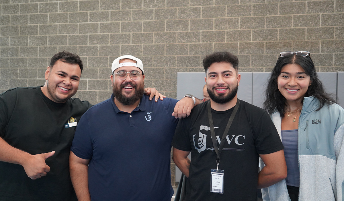 Four WVC staff members stand together and smile at the camera.
