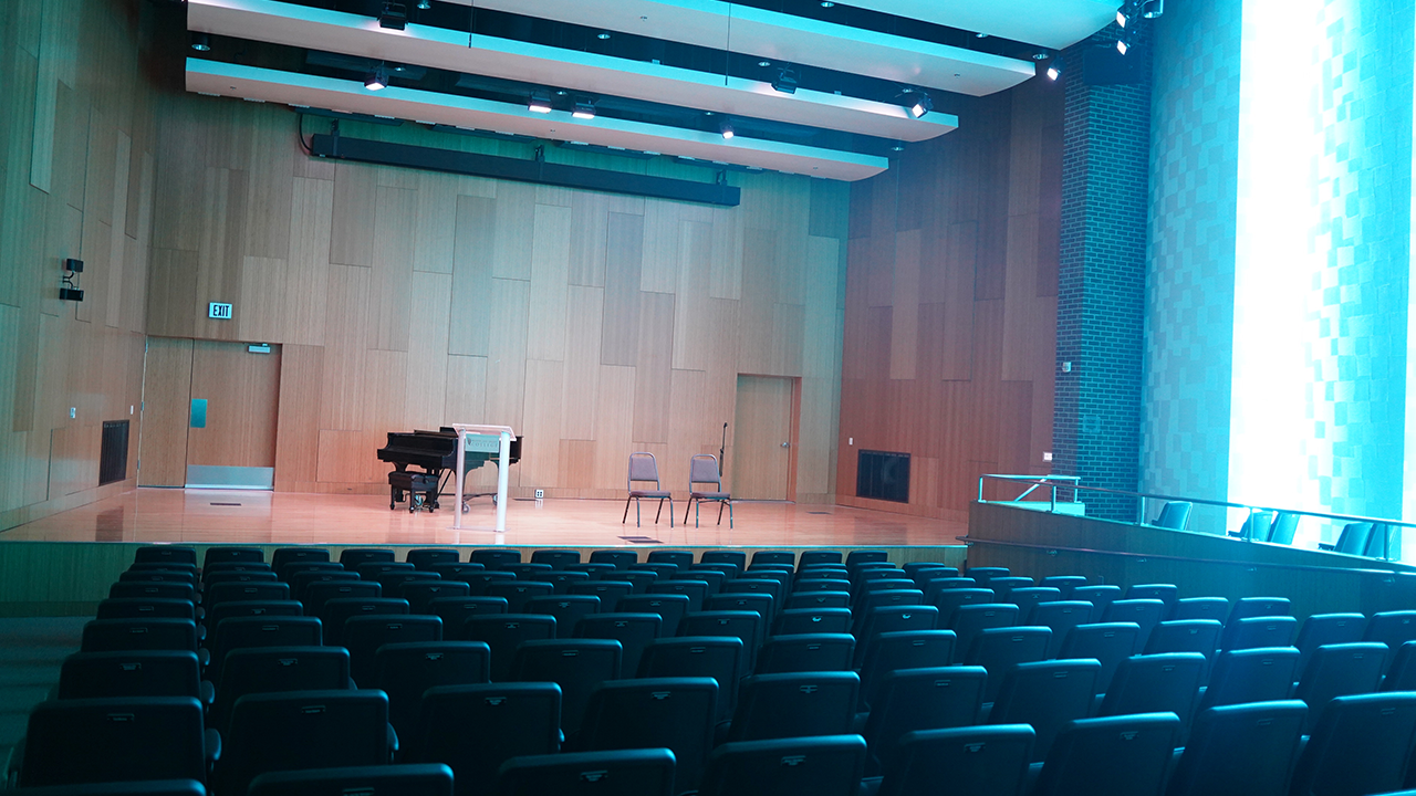The Grove Recital Hall, stage, seats, and blue sidelight