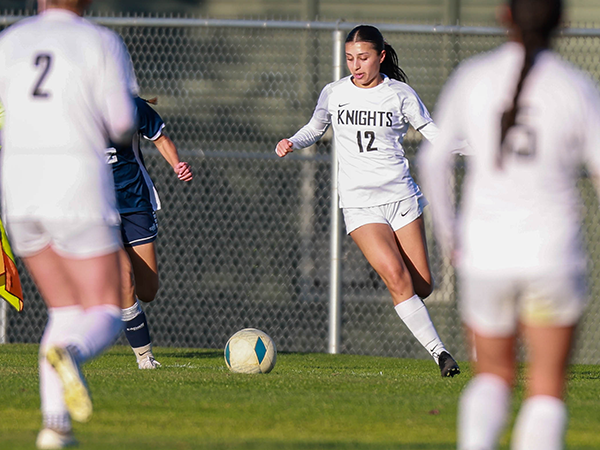 A Knights soccer player gets ready to kick a soccer ball.